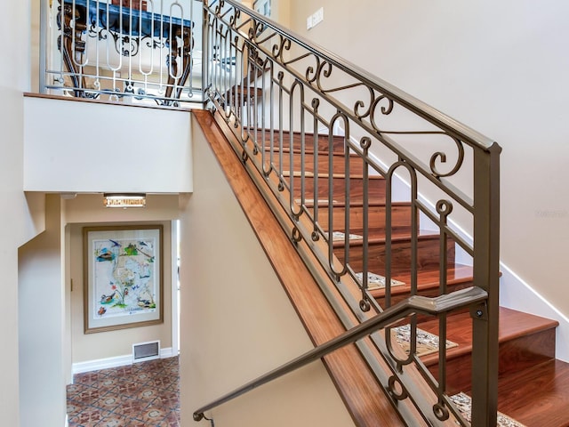 8 Sunset Bay Dr, Belleair, FL 33756 - stairs featuring baseboards