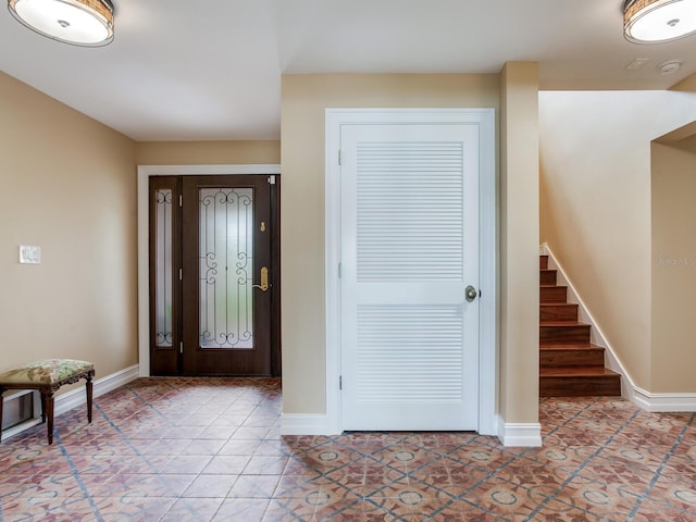 8 Sunset Bay Dr, Belleair, FL 33756 - entrance foyer with stairway and light tile patterned floors