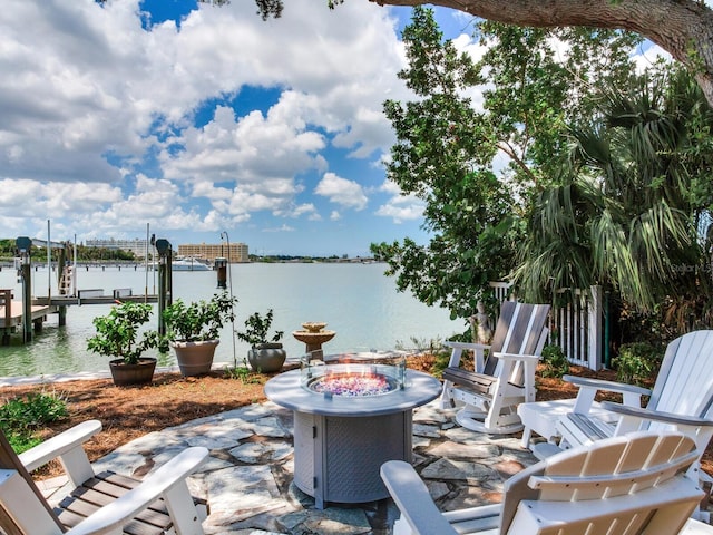 8 Sunset Bay Dr, Belleair, FL 33756 - view of patio featuring a water view, a fire pit, a boat dock, and boat lift