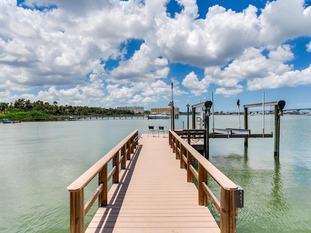 8 Sunset Bay Dr, Belleair, FL 33756 - dock area featuring boat lift and a water view