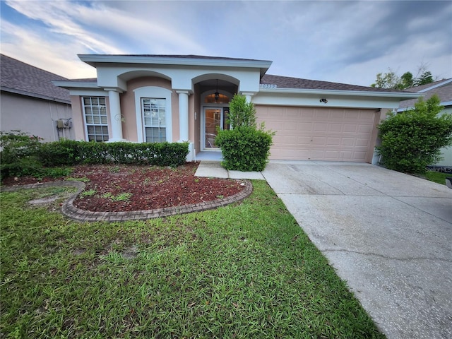 10539 Egret Haven Ln, Riverview, FL 33578 - ranch-style home featuring concrete driveway, a garage, and stucco siding