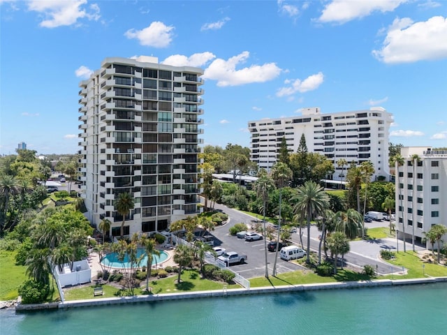 80 Rogers St Unit 3A, Clearwater, FL 33756 - view of apartment building / complex with uncovered parking and a water view