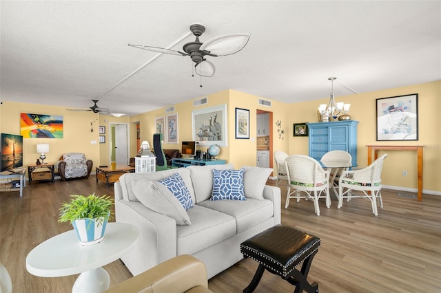 80 Rogers St Unit 3A, Clearwater, FL 33756 - living room with ceiling fan, wood finished floors, and a chandelier