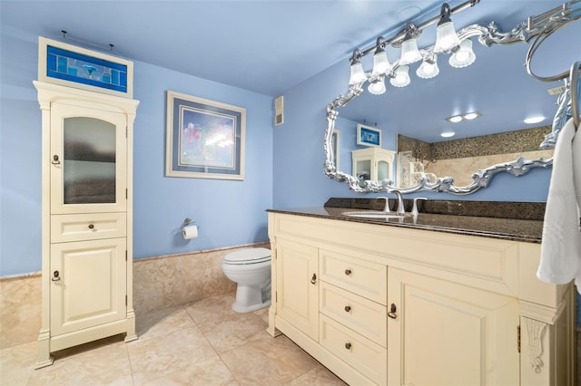 80 Rogers St Unit 3A, Clearwater, FL 33756 - full bathroom featuring vanity, tile patterned flooring, and wainscoting