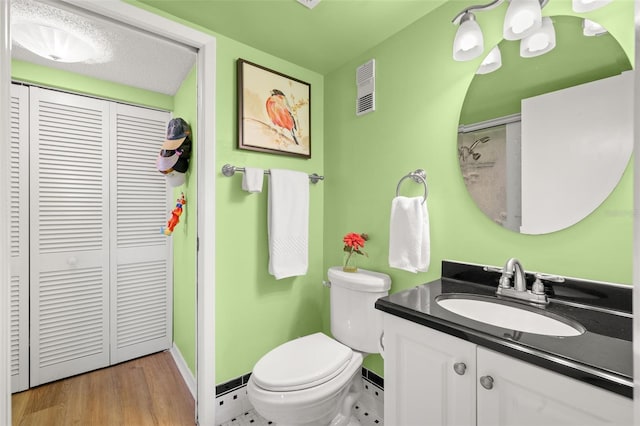 80 Rogers St Unit 3A, Clearwater, FL 33756 - bathroom with a closet, vanity, and wood finished floors