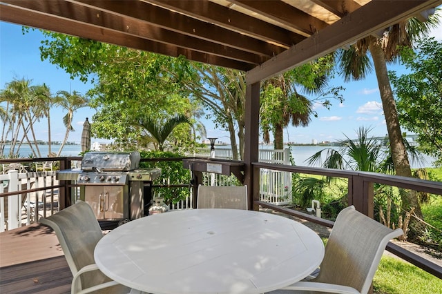 80 Rogers St Unit 3A, Clearwater, FL 33756 - deck with a water view, outdoor dining space, and grilling area