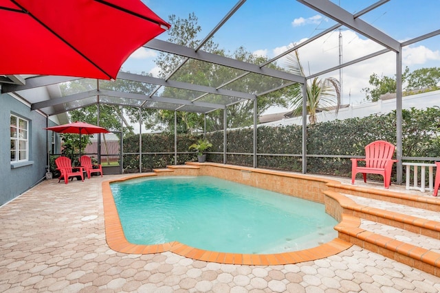 8629 Wolf Den Trl, Port Richey, FL 34668 - view of swimming pool with a lanai and a patio area