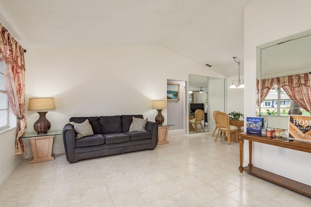 8629 Wolf Den Trl, Port Richey, FL 34668 - living room with vaulted ceiling and baseboards