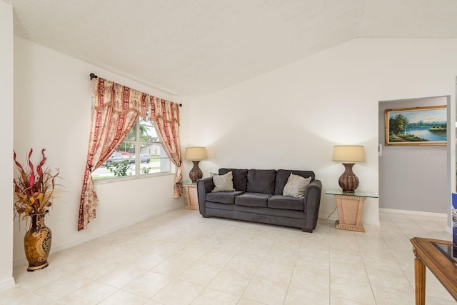 8629 Wolf Den Trl, Port Richey, FL 34668 - living room featuring lofted ceiling and light tile patterned floors