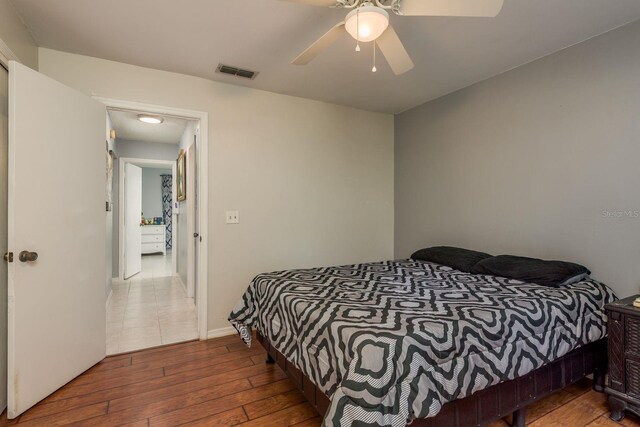 8629 Wolf Den Trl, Port Richey, FL 34668 - bedroom with hardwood / wood-style flooring and a ceiling fan