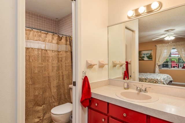 8629 Wolf Den Trl, Port Richey, FL 34668 - ensuite bathroom featuring vanity, a ceiling fan, a shower with curtain, and a textured ceiling