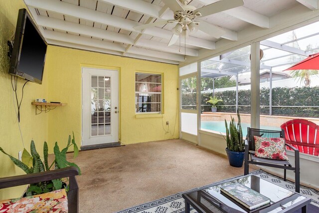 8629 Wolf Den Trl, Port Richey, FL 34668 - sunroom with a ceiling fan and beam ceiling