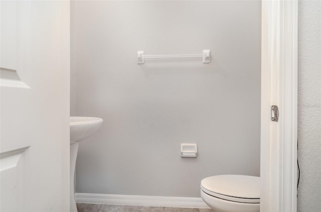 9741 Mulberry Marsh Ln, Sun City Center, FL 33573 - bathroom with toilet and baseboards