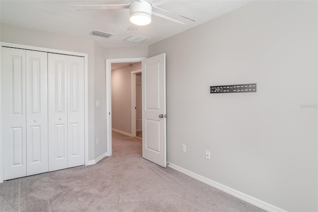 9741 Mulberry Marsh Ln, Sun City Center, FL 33573 - unfurnished bedroom featuring carpet, a closet, and a ceiling fan