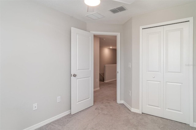 9741 Mulberry Marsh Ln, Sun City Center, FL 33573 - unfurnished bedroom with light colored carpet and a closet