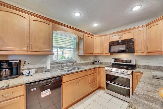 1502 Fort Duquesna Dr, Sun City Center, FL 33573 - kitchen with black appliances, a textured ceiling, light stone countertops, light tile patterned flooring, and light brown cabinetry