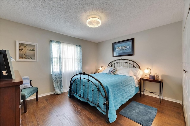 1502 Fort Duquesna Dr, Sun City Center, FL 33573 - bedroom featuring wood finished floors and a textured ceiling