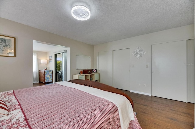 1502 Fort Duquesna Dr, Sun City Center, FL 33573 - bedroom featuring a textured ceiling and wood finished floors