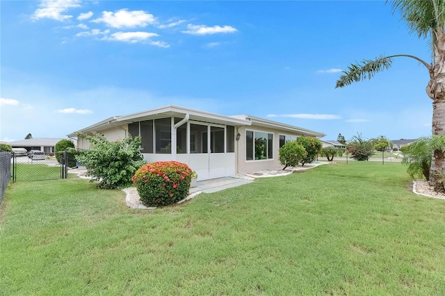 1502 Fort Duquesna Dr, Sun City Center, FL 33573 - rear view of house featuring a sunroom and a gate