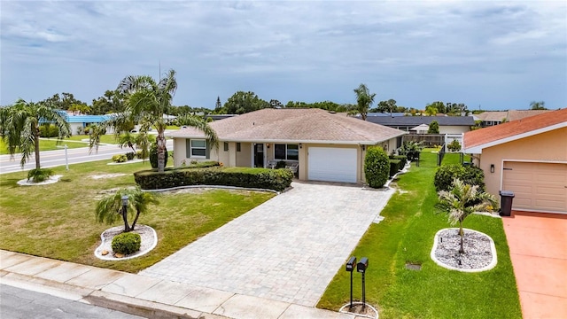 1502 Fort Duquesna Dr, Sun City Center, FL 33573 - single story home with decorative driveway, an attached garage, and a front lawn