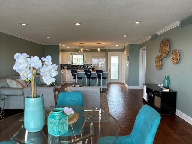 1365 Snell Isle Blvd NE Unit 6E, Saint Petersburg, FL 33704 - living area with dark wood-style floors, a ceiling fan, recessed lighting, and crown molding