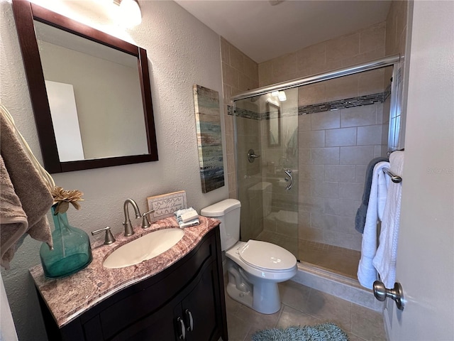 1365 Snell Isle Blvd NE Unit 6E, Saint Petersburg, FL 33704 - bathroom with a textured wall, a shower stall, vanity, and tile patterned flooring