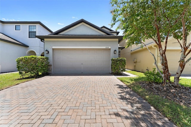 1604 Acadia Harbor Pl, Brandon, FL 33511 - single story home featuring stucco siding, decorative driveway, and an attached garage