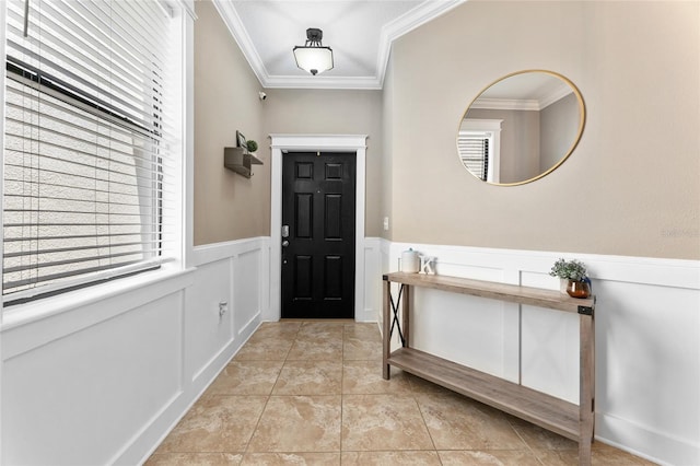 1604 Acadia Harbor Pl, Brandon, FL 33511 - foyer entrance with crown molding, wainscoting, a decorative wall, and light tile patterned floors