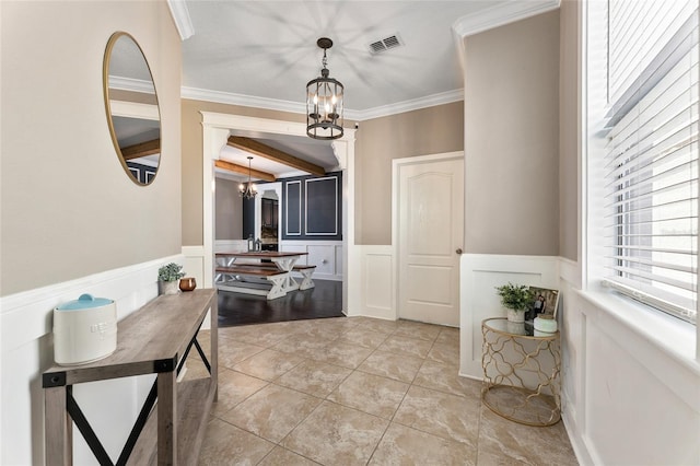 1604 Acadia Harbor Pl, Brandon, FL 33511 - foyer entrance featuring a chandelier, wainscoting, crown molding, beamed ceiling, and light tile patterned flooring