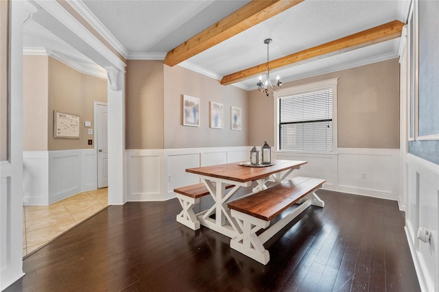 1604 Acadia Harbor Pl, Brandon, FL 33511 - dining space featuring dark wood-type flooring, beam ceiling, wainscoting, a chandelier, and crown molding