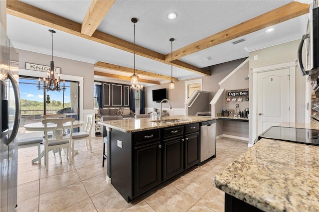 1604 Acadia Harbor Pl, Brandon, FL 33511 - kitchen featuring a chandelier, dark cabinetry, stainless steel appliances, open floor plan, and beam ceiling