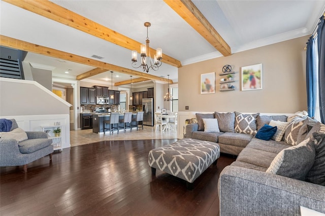 1604 Acadia Harbor Pl, Brandon, FL 33511 - living room with a chandelier, beamed ceiling, hardwood / wood-style floors, and crown molding