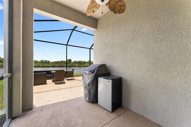 1604 Acadia Harbor Pl, Brandon, FL 33511 - view of patio / terrace featuring a water view, ceiling fan, a lanai, and outdoor dining space
