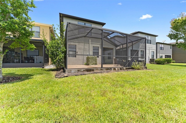 1604 Acadia Harbor Pl, Brandon, FL 33511 - rear view of property featuring a lawn, stucco siding, a lanai, and a patio area