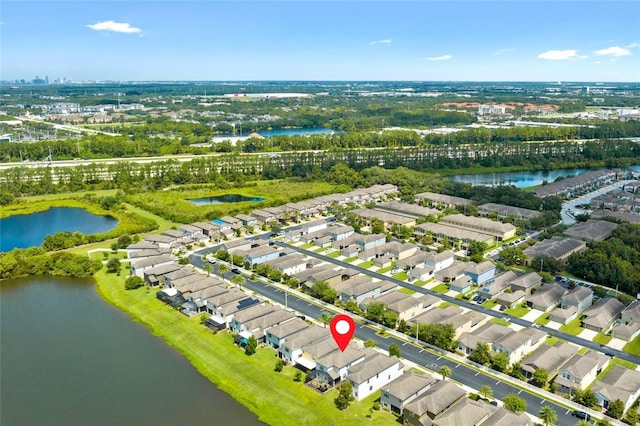1604 Acadia Harbor Pl, Brandon, FL 33511 - aerial perspective of suburban area with a large body of water and a tree filled landscape