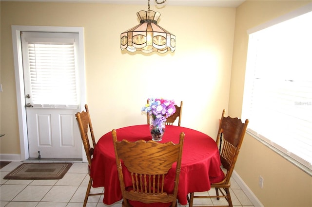 402 Dorchester Pl Unit 44, Sun City Center, FL 33573 - dining area with light tile patterned floors and baseboards