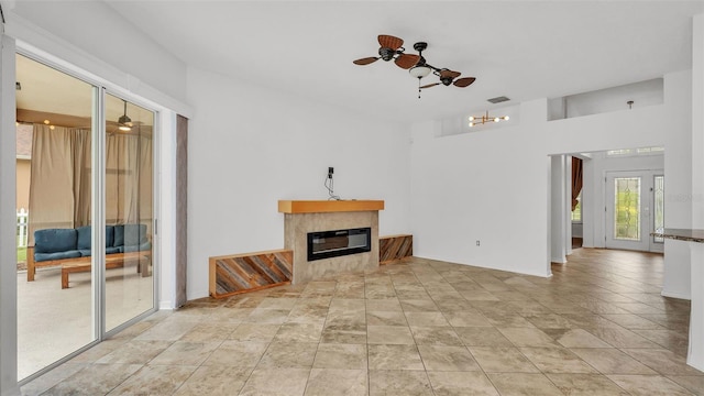 2202 Hickory Ridge Dr, Valrico, FL 33596 - unfurnished living room with a fireplace and ceiling fan