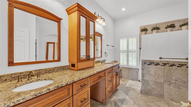 2202 Hickory Ridge Dr, Valrico, FL 33596 - bathroom with double vanity, tile walls, and tile patterned flooring