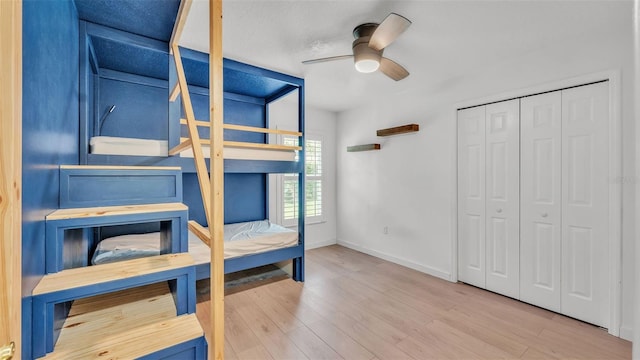 2202 Hickory Ridge Dr, Valrico, FL 33596 - unfurnished bedroom with wood finished floors, a closet, and a ceiling fan