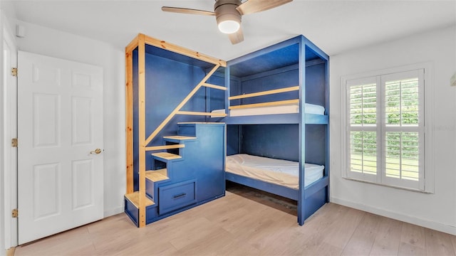 2202 Hickory Ridge Dr, Valrico, FL 33596 - unfurnished bedroom with wood finished floors and ceiling fan