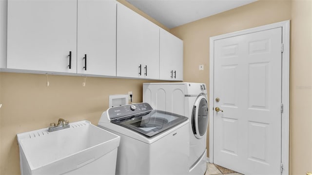 2202 Hickory Ridge Dr, Valrico, FL 33596 - laundry room featuring washer and dryer and cabinet space