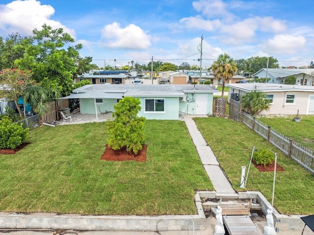 13316 Carol Dr, Hudson, FL 34667 - back of property with a fenced backyard and stucco siding