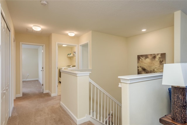 19309 Prairie Tree Pl, Tampa, FL 33647 - hall featuring an upstairs landing, light colored carpet, and recessed lighting
