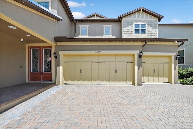 10313 Scarlet Chase Dr, Riverview, FL 33569 - garage featuring decorative driveway