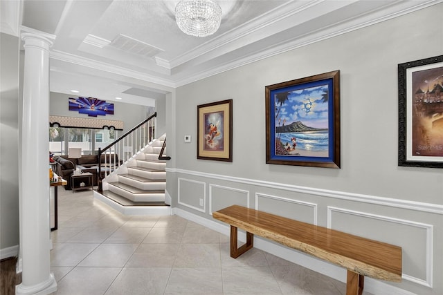 10313 Scarlet Chase Dr, Riverview, FL 33569 - foyer entrance featuring ornate columns, ornamental molding, a chandelier, a decorative wall, and stairway