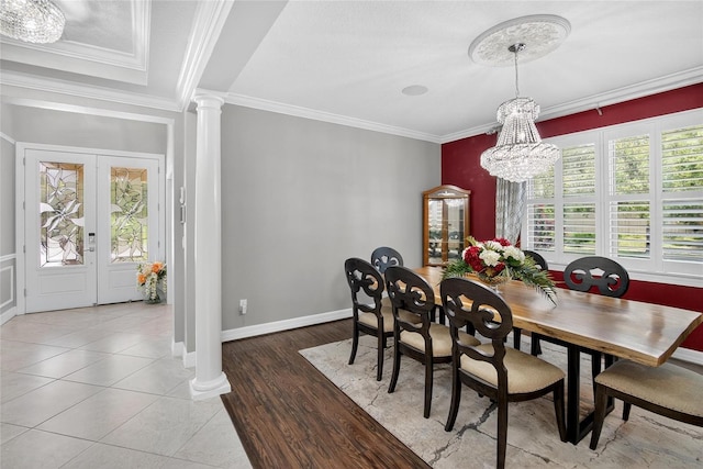 10313 Scarlet Chase Dr, Riverview, FL 33569 - dining room with a chandelier, crown molding, ornate columns, and wood finished floors
