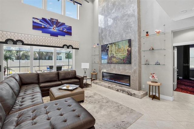 10313 Scarlet Chase Dr, Riverview, FL 33569 - living area with a high ceiling, a fireplace, and plenty of natural light