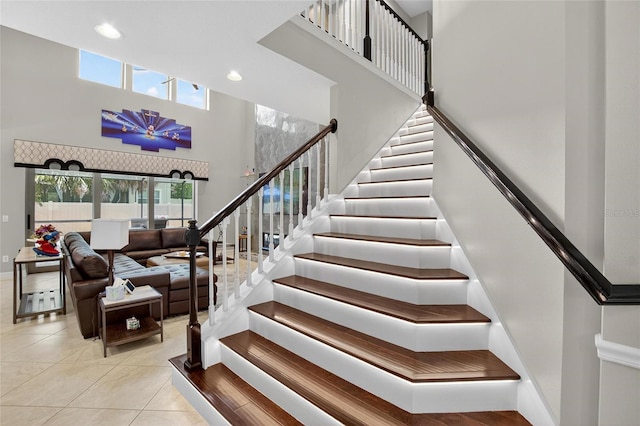 10313 Scarlet Chase Dr, Riverview, FL 33569 - staircase with a high ceiling, tile patterned floors, and recessed lighting