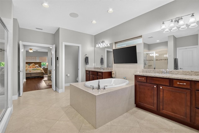 10313 Scarlet Chase Dr, Riverview, FL 33569 - full bathroom featuring a shower stall, connected bathroom, a garden tub, tile patterned flooring, and two vanities