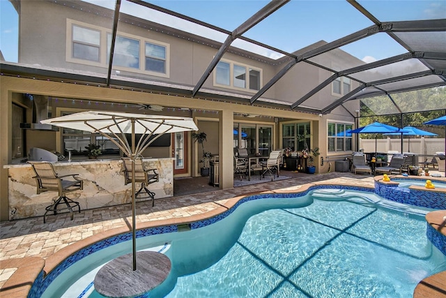 10313 Scarlet Chase Dr, Riverview, FL 33569 - view of swimming pool with exterior bar, a pool with connected hot tub, a patio, glass enclosure, and ceiling fan